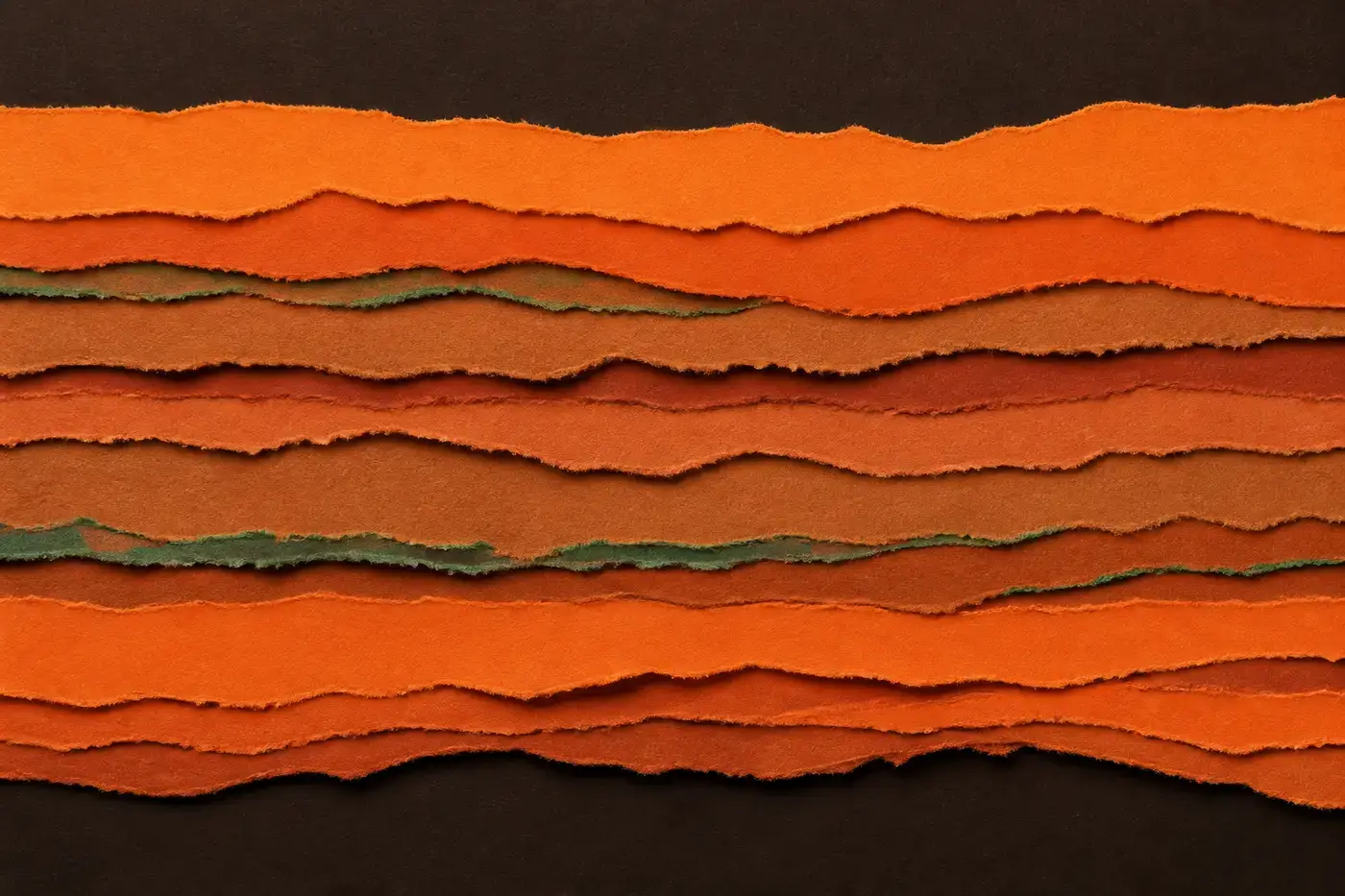Abstract paper collage — layered orange strata crossed by fine green threads